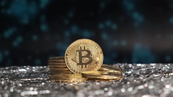 A Closeup of the Bitcoin Coin Is Poured with Gold Light alt