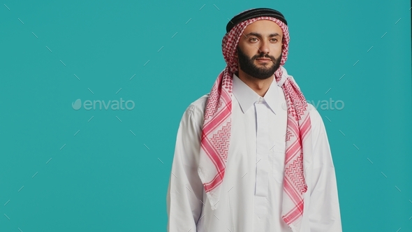 Middle eastern man in traditional attire - Stock Photo - Images