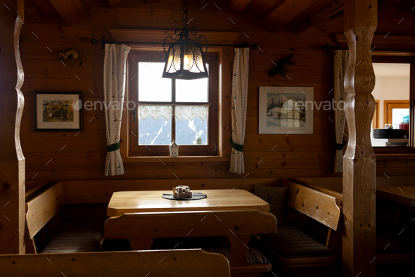 Austrian cafe in a wooden house in hunting style. A separate table for the company