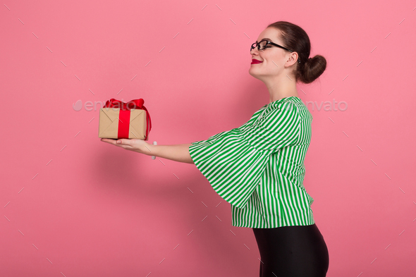 Businesswoman with hair bun and present