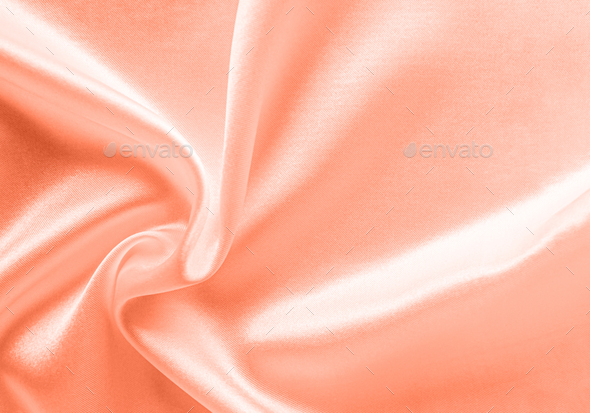 Peach Fuzz Silk fabric, delicate satin with soft pleats. Color of the year  2024 for design. Stock Photo by albinasol777