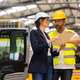Forklift driver talking with manager in modern industrial factory. Warehouseman reading order, order - PhotoDune Item for Sale