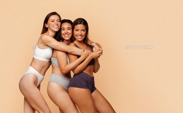 Smiling diverse young women in sports underwear enjoy friendship, diverse  beauty Stock Photo by Prostock-studio