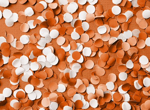 Color of the year 2024: Peach Fuzz. colorful circle shape confetti from shredded paper