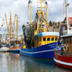 Colorful traditional old german fishing cutter boats moored  Neuharlingersiel harbor Wadden sea East Stock Photo by Gorlovkv