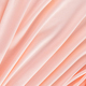 Peach Fuzz Silk fabric, delicate satin with soft pleats. Color of