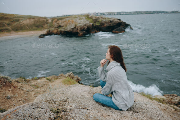 pretty woman beach tourism cloudy weather stone coast Lifestyle Stock Photo  by shotprime