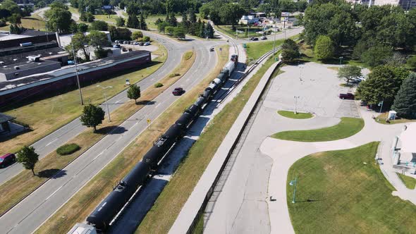 Reverse dolly or pull away as train moves forward. alt