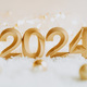 Greeting card - happy new year with numbers 2024 in artificial snow on white background - PhotoDune Item for Sale