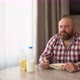 Happy Bearded Man Having Breakfast at Home in Milk and Cereal - VideoHive Item for Sale