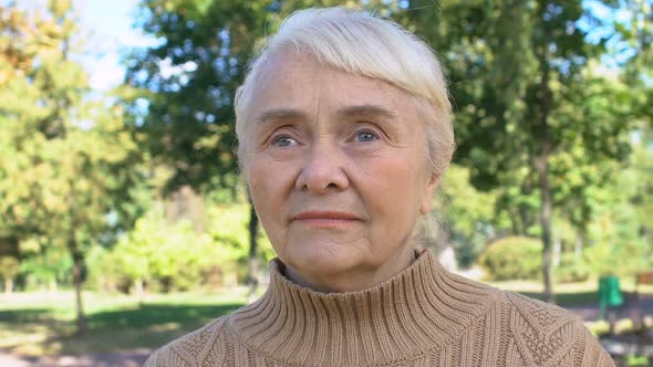 Caucasian Retired Lady Sitting Park, Peaceful Rest Countryside, Aged Generation