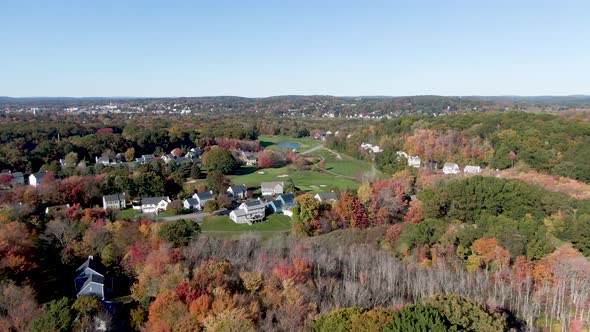Beautiful town of Haverhill with beautiful autumn colors, aerial drone fly forward view alt