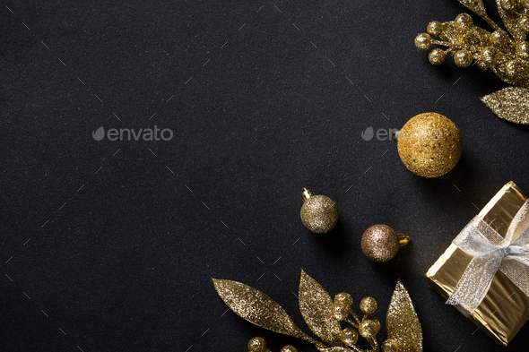 Christmas background with gold and silver decorations on black Stock Photo  by Nadianb