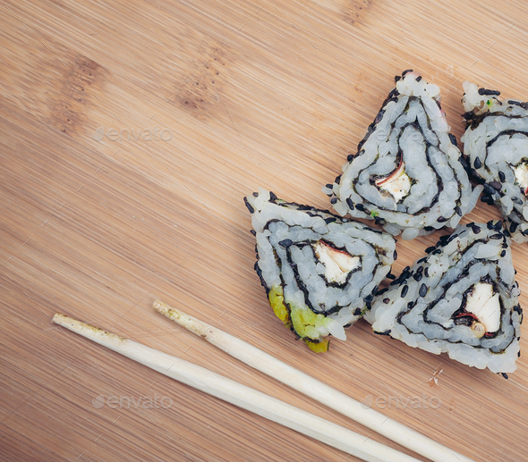 sushi rolls chopsticks food ration delicacy wood board japanese cuisine