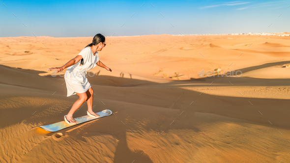 Dubai dessert sand dunes, couple on Dubai desert safari,United Arab Emirates, woman vacation in
