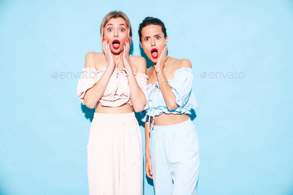 Two beautiful brunette women in studio Stock Photo by halayalex