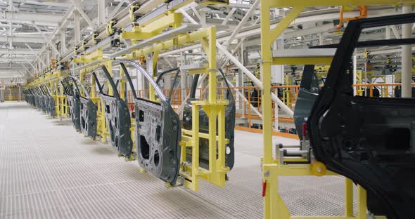 Automobile Plant, Modern Production of Cars, Transportation of Ready Car Doors on the Production alt