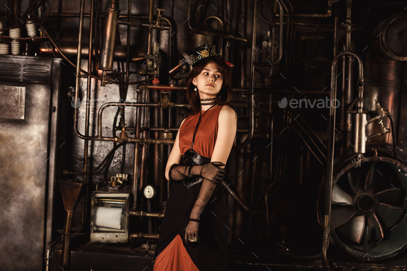 Stylish teen girl model in steampunk image in retro brown dress and top hat
