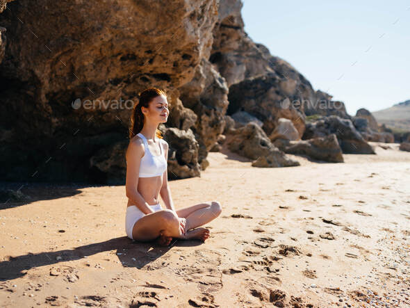 Swimwear sits on the sand recreation meditation landscape