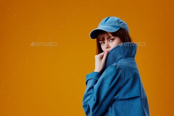 Pretty young female denim clothing fashion posing cap studio model unaltered  Stock Photo by shotprime