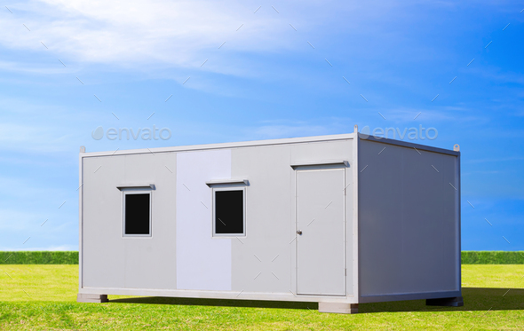 Mobile sandwich panel office container for rent and sale on green lawn with blue sky background
