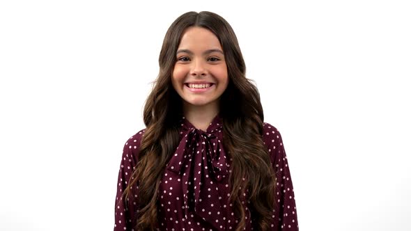 Cute Cheerful Teen Girl Long Curly Hair Looks Shy Isolated on White Positive Emotions alt