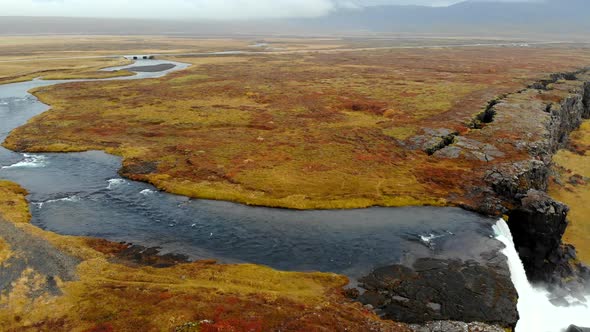 Aerial View Autumn Landscape in Iceland, Rocky Canyon with Waterfall alt