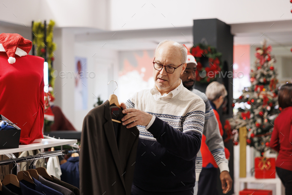 Older customer looking at fabric