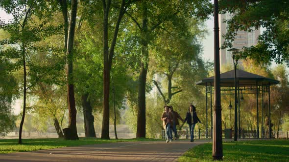 Child Running Park Path Enjoying Family Evening Outdoors alt