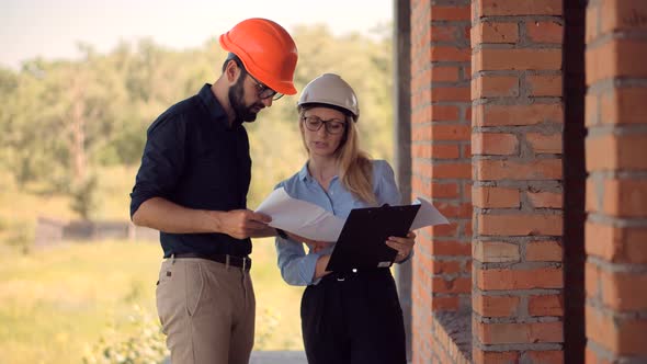 Real Estate Building Project Architect. Builder Constructor Read Blueprints. Inspecting Building. alt