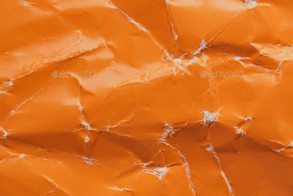 Orange crumpled paper background with folds texture Stock Photo by colnihko