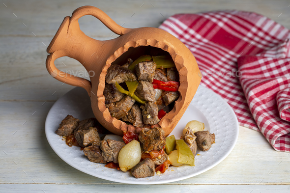 Authentic Turkish Testi Kebab cooked in earthenware waterjug, Turkish name; Testi kebabi - Stock Photo - Images