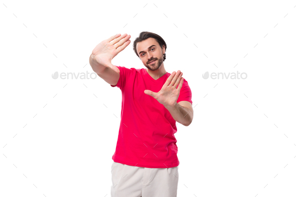 young black-haired european man dressed in red corporate t-shirt with logo print mockup