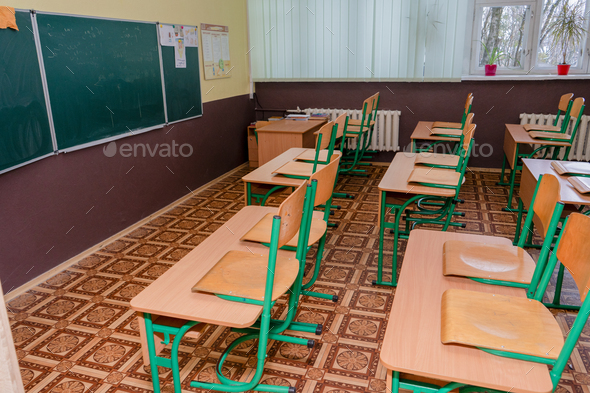 Furniture at school. Empty class. Wooden desks with chair. Double table.