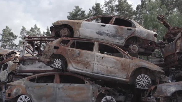 War in Ukraine a Dump of Shot and Burned Cars in Irpin Bucha District alt