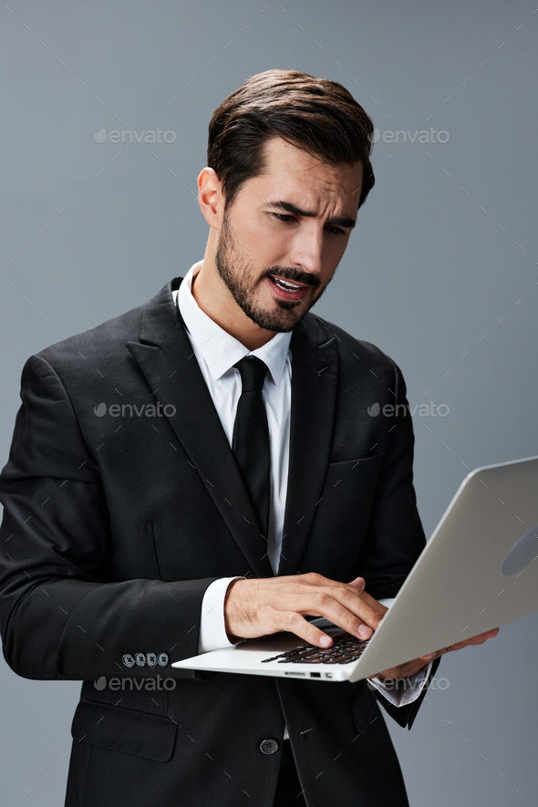 Man business tired stressed out looking at his laptop and working online via internet in business