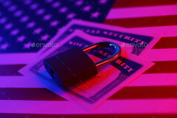 Padlock and social security card on United States flag. Identity theft and identity protection
