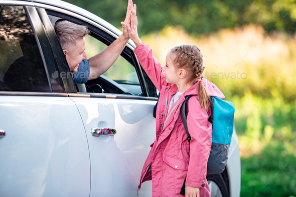 Dad Picks Up Little Daughter From School In Car And High Fives Her