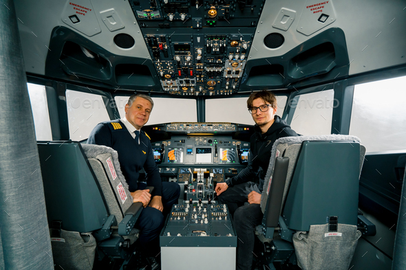 airplane cockpit pilot and young student boy smiling after training on flight simulator