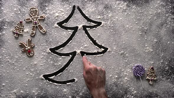 Creative background concept - hand draws Xmas tree in flour - Festive Christmas and Holiday season