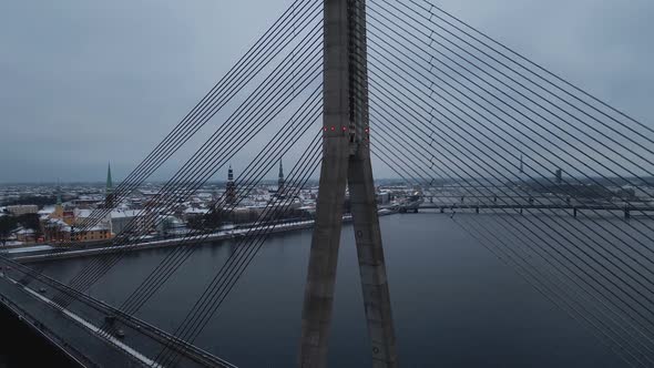 Aerial Revealing Shot of Vansu Bridge with Car Traffic During Winter alt