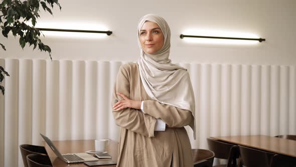 Muslim Woman on Remote Working Online Education or Video Conversation in Caffe alt