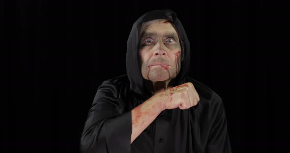 Old Executioner Halloween Makeup and Costume Elderly Man with Blood on His Face alt