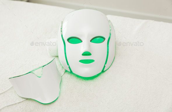 LED mask for facial rejuvenation. glows in different colors. Stock Photo by  innasap