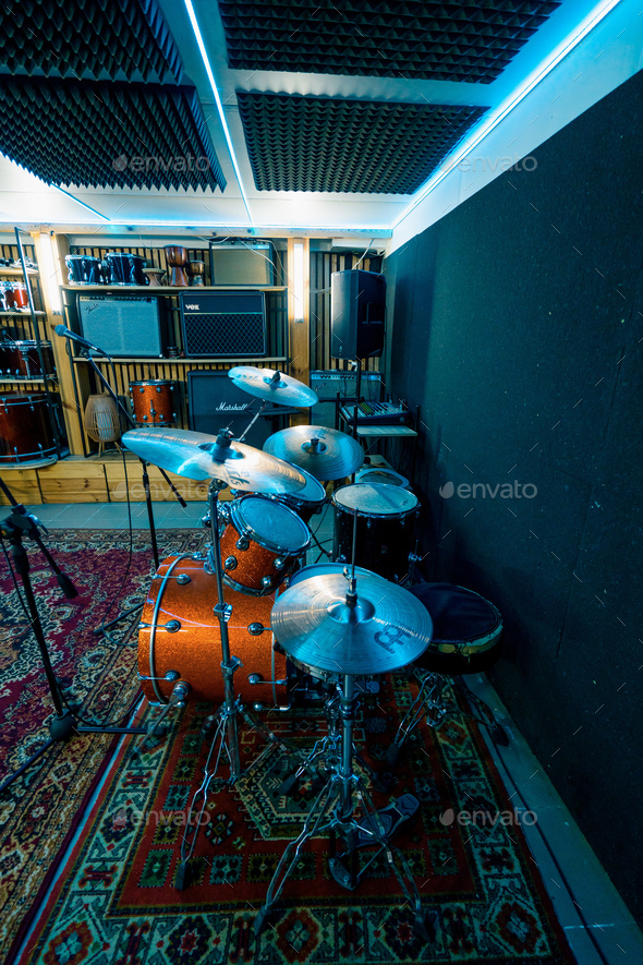 empty professional recording studio with musical instruments drums speaker rack with microphone neon
