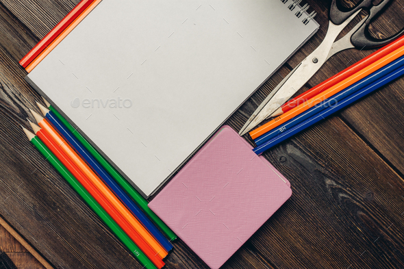 pencils for drawing notepad scissors office wooden table Stock Photo by  shotprime