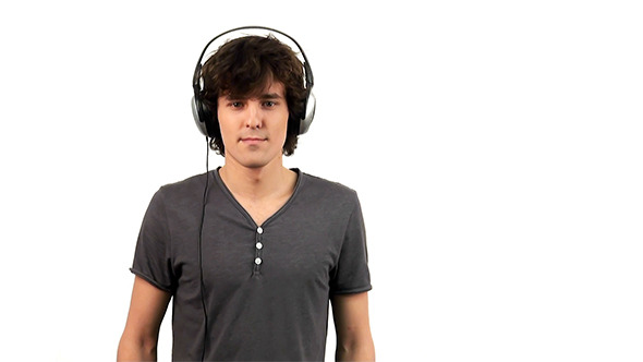 Young Man Listening To Music In Headphones