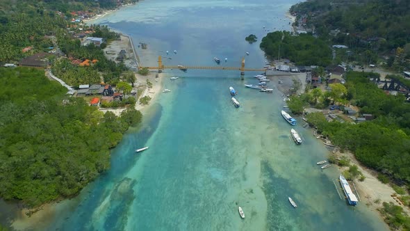 Aerial View of the Yellow Bridge Connecting Nusa Lembongan and Cennigan Islands alt