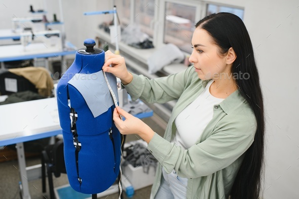 Premium Photo  Portrait of a beautiful seamstress carrying a tape