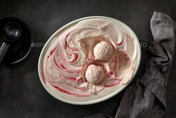 Ice cream ball with strawberry pieces Stock Photo by magone